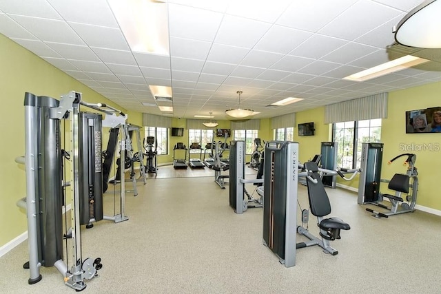 workout area with a paneled ceiling