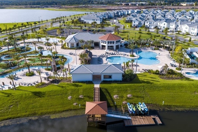 birds eye view of property with a water view