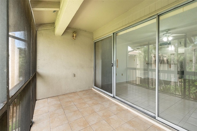 exterior space featuring beam ceiling and ceiling fan