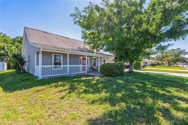 view of front of house featuring a front lawn and covered porch