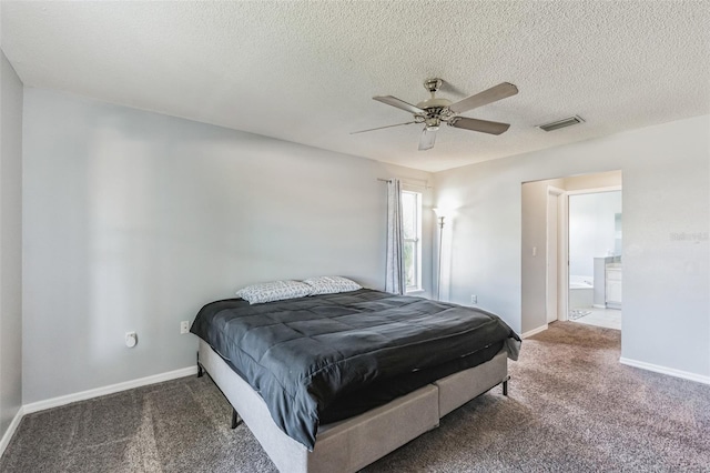 bedroom with a textured ceiling, ceiling fan, and carpet