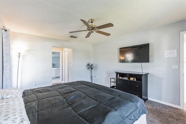 carpeted bedroom with connected bathroom, ceiling fan, and a textured ceiling