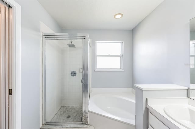 bathroom with independent shower and bath and vanity