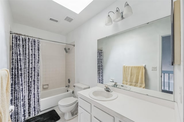 full bathroom with tile flooring, vanity, toilet, and shower / bath combo with shower curtain