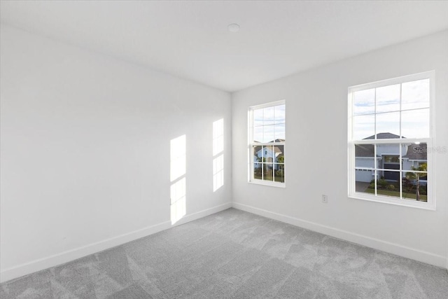 empty room featuring light carpet