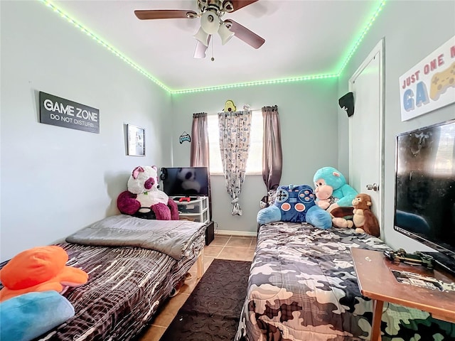 bedroom featuring light tile patterned floors and a ceiling fan