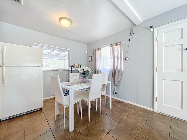 tiled dining area with baseboards