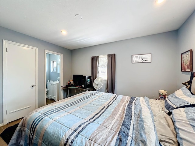 bedroom featuring connected bathroom