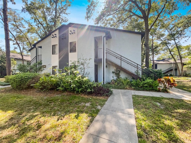 view of property exterior featuring a yard