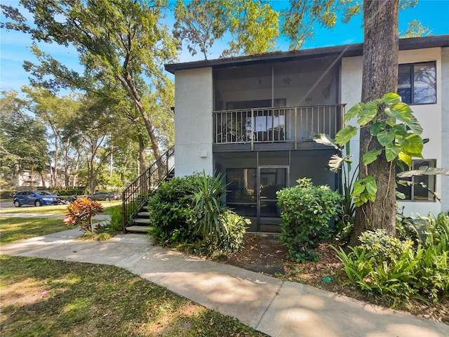 view of front of house featuring a balcony