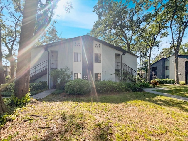 view of home's exterior with a lawn