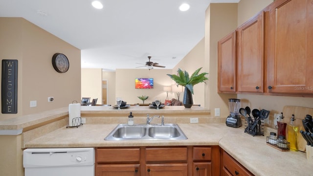 kitchen featuring kitchen peninsula, ceiling fan, sink, and white dishwasher