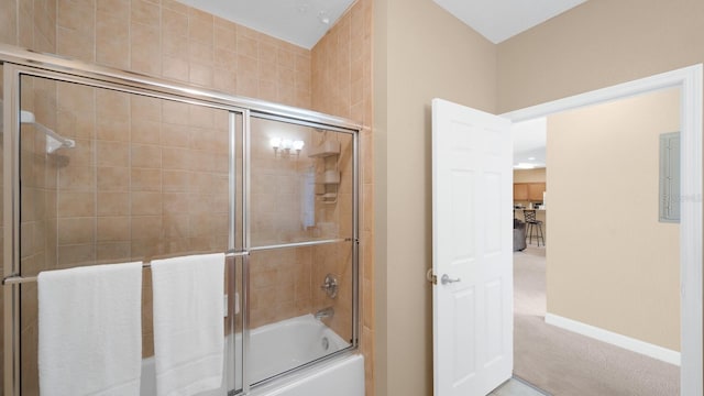 bathroom with shower / bath combination with glass door