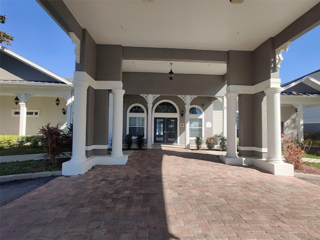 view of patio featuring french doors and covered porch