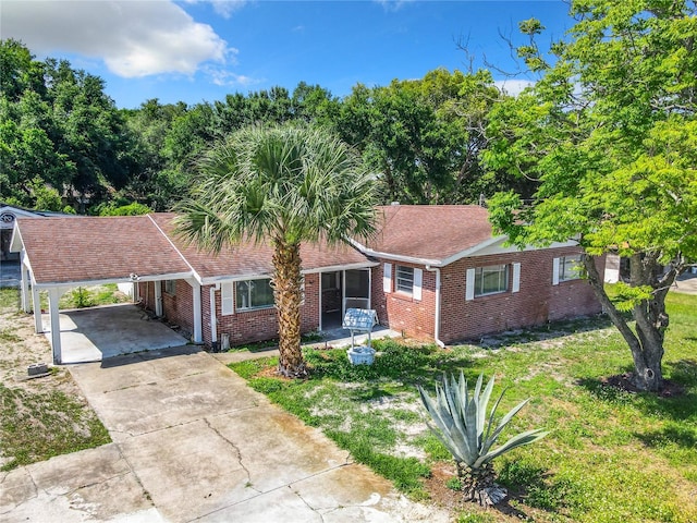 single story home with a carport and a front yard