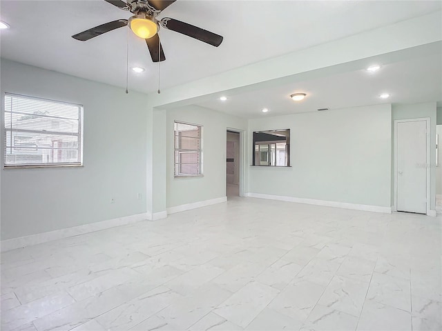 tiled empty room with ceiling fan