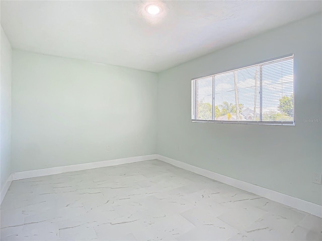 empty room with tile flooring