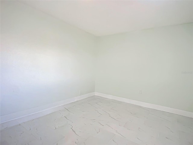 empty room featuring tile flooring