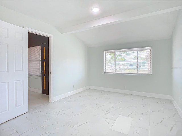 unfurnished room with light tile flooring and vaulted ceiling with beams