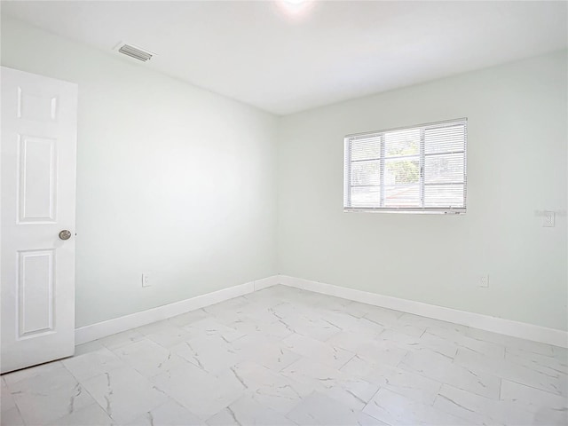 view of tiled spare room