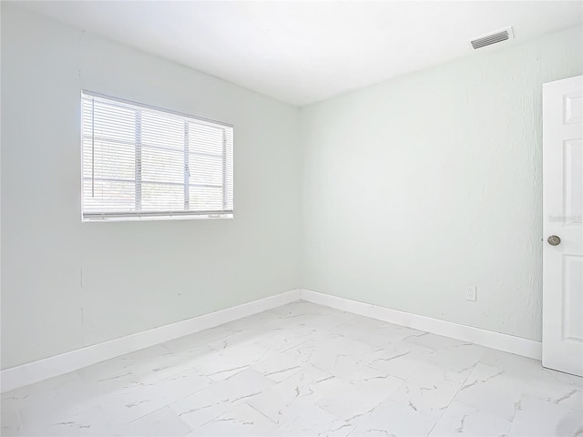 spare room with light tile flooring