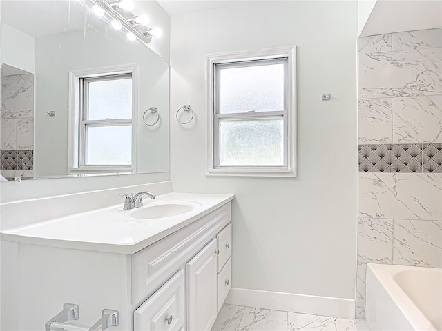 bathroom featuring vanity with extensive cabinet space, tile floors, and a wealth of natural light