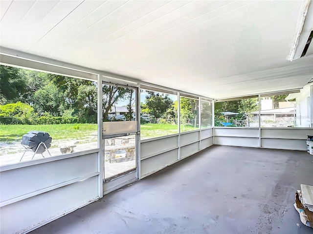 unfurnished sunroom featuring a healthy amount of sunlight