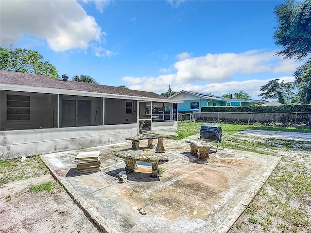 view of patio with a sunroom