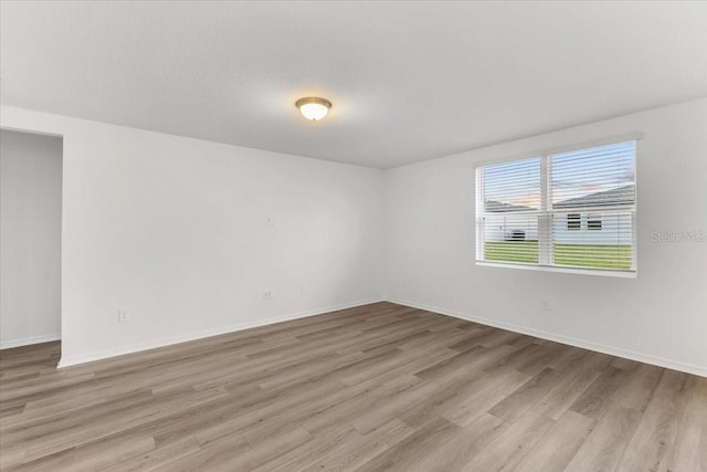 unfurnished room featuring light wood-type flooring