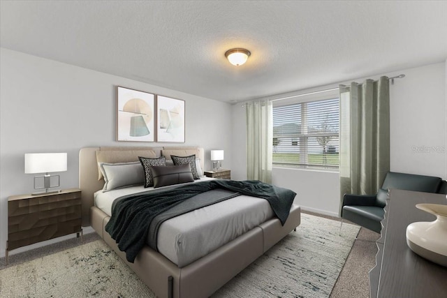 bedroom featuring light carpet and a textured ceiling