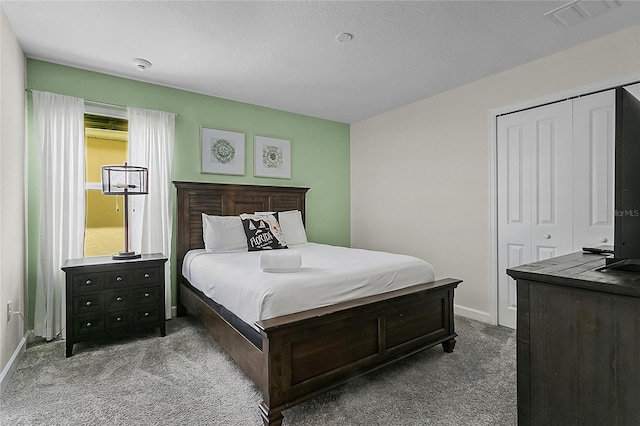 bedroom featuring a closet and carpet flooring