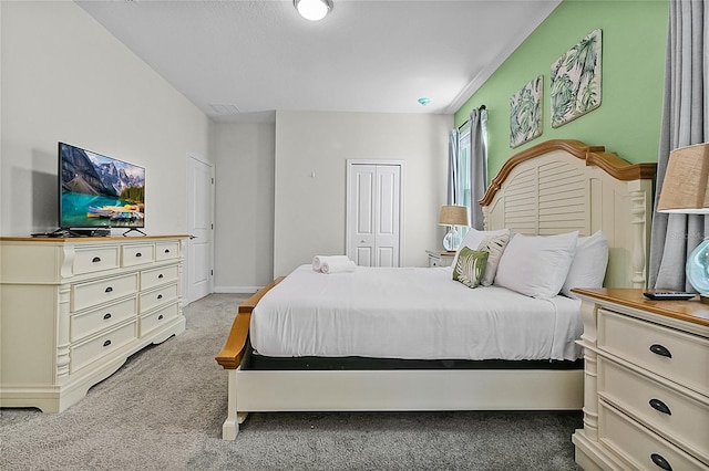 bedroom featuring a closet and carpet floors