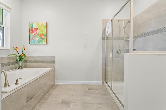 bathroom featuring tile floors and separate shower and tub