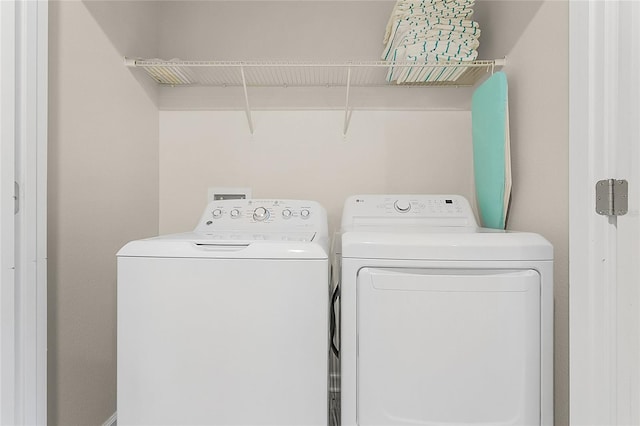 laundry room featuring washing machine and dryer