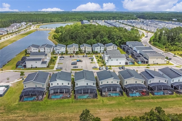 birds eye view of property with a water view