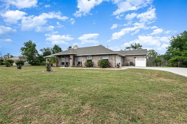 view of front of home with a front yard and a garage