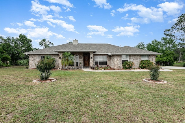 ranch-style home featuring a front yard