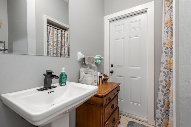 bathroom featuring sink and tile floors