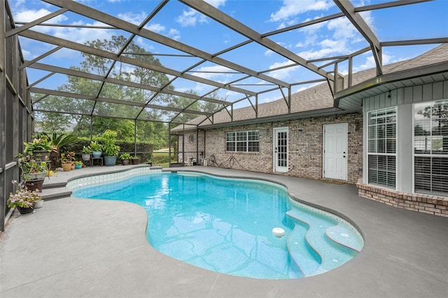 view of pool featuring a patio and glass enclosure