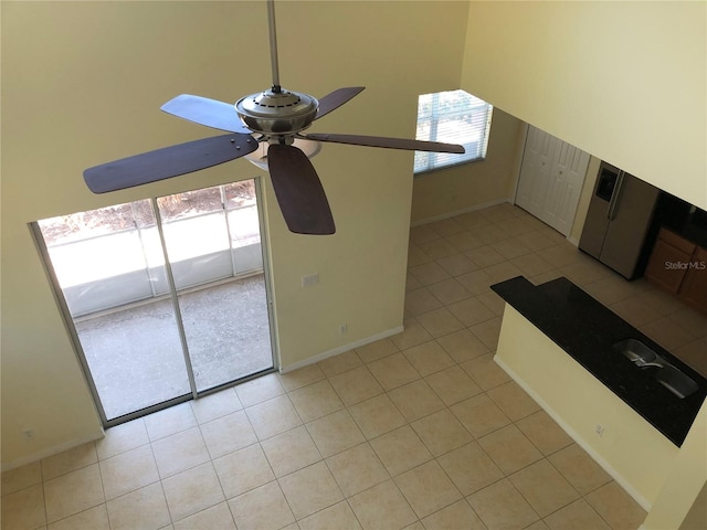 interior space with ceiling fan