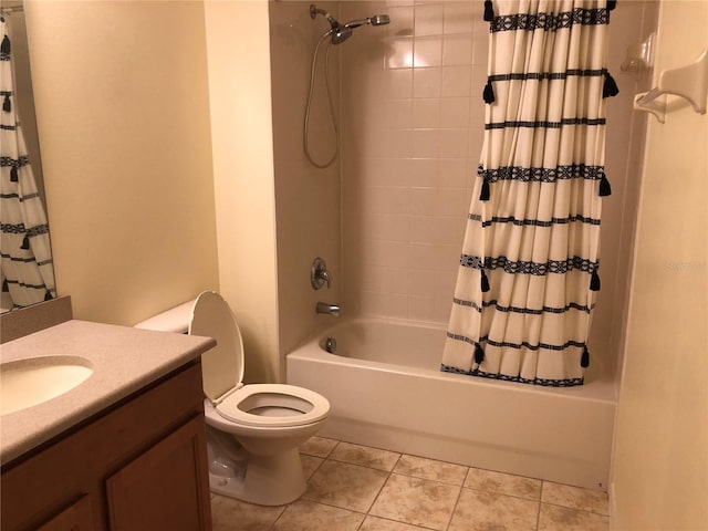 full bathroom with toilet, shower / tub combo, vanity, and tile patterned floors