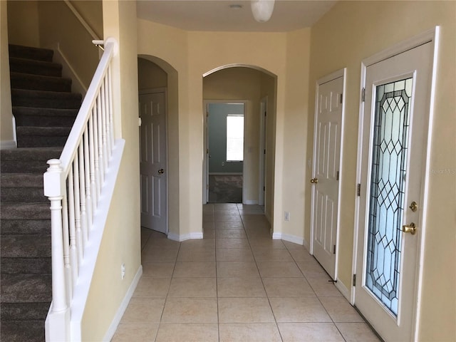 entryway featuring light tile patterned floors