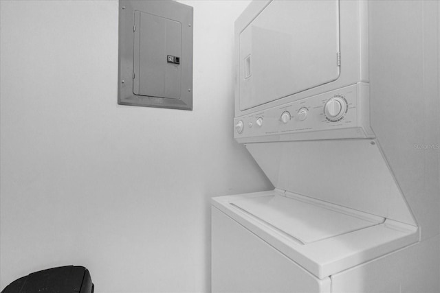 washroom with stacked washer and dryer