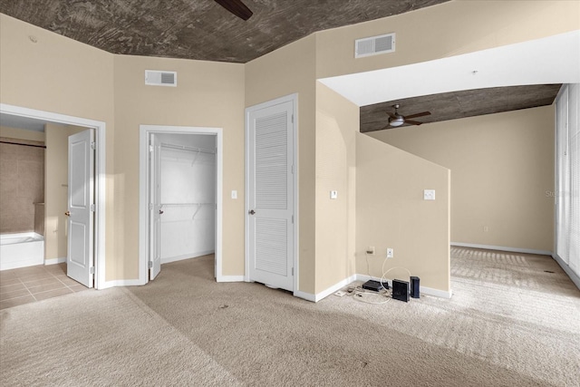 unfurnished room with light carpet and ceiling fan