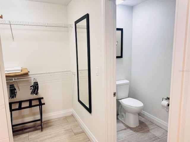 bathroom featuring toilet and tile patterned floors