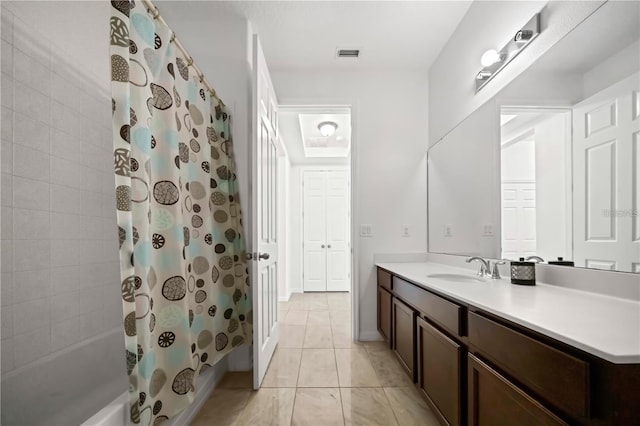 bathroom with tile floors, shower / tub combo, and vanity