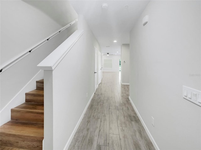 hallway with light hardwood / wood-style flooring