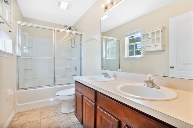 full bathroom featuring toilet, tile patterned flooring, a sink, and visible vents