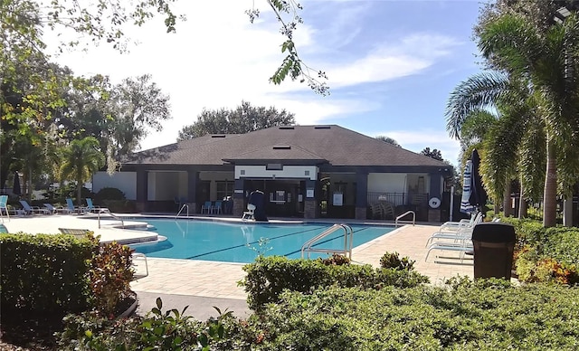 pool featuring a patio area and fence