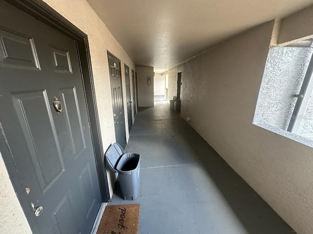 hallway featuring concrete floors